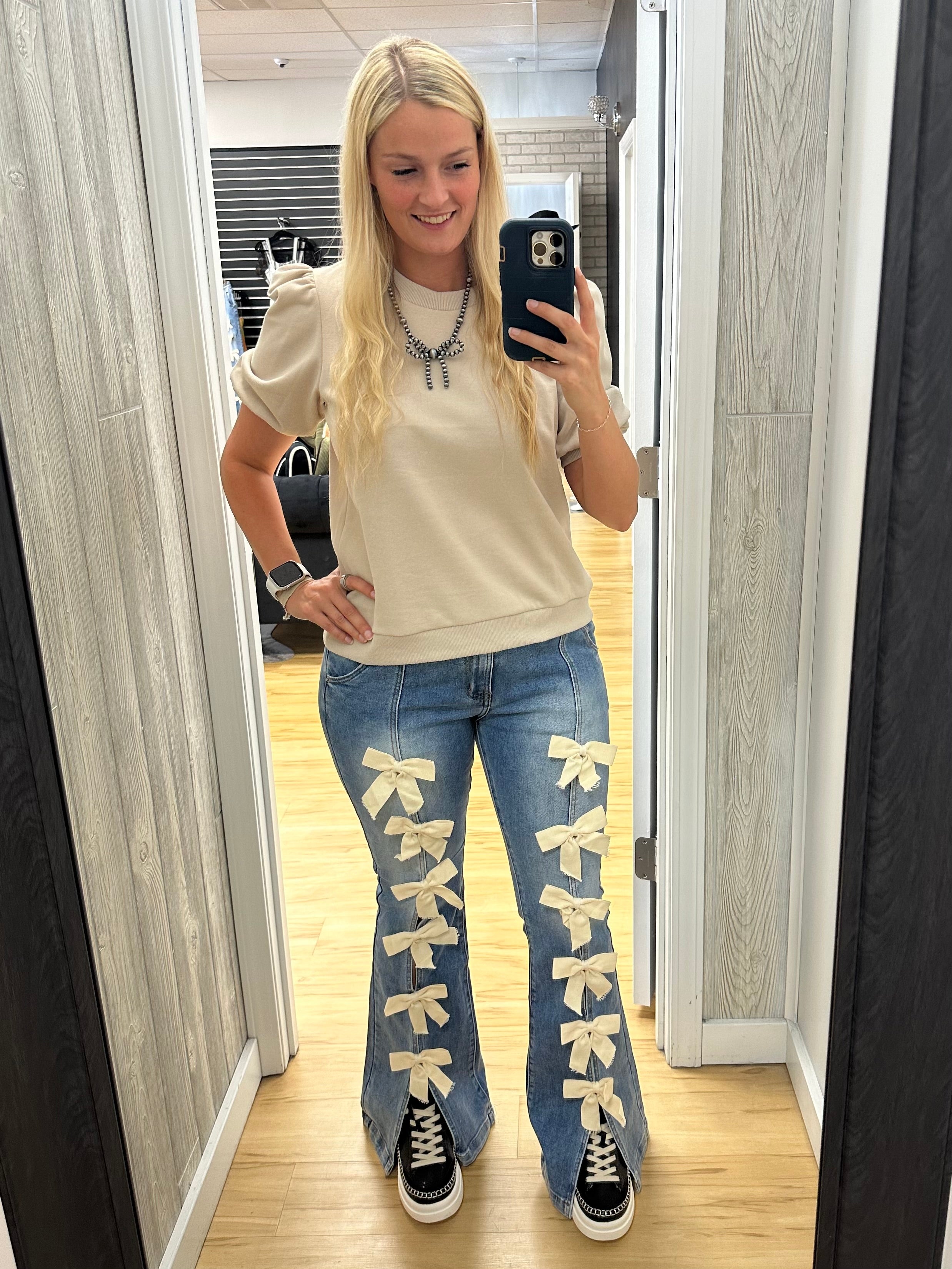 Cream Bow Flared Jeans