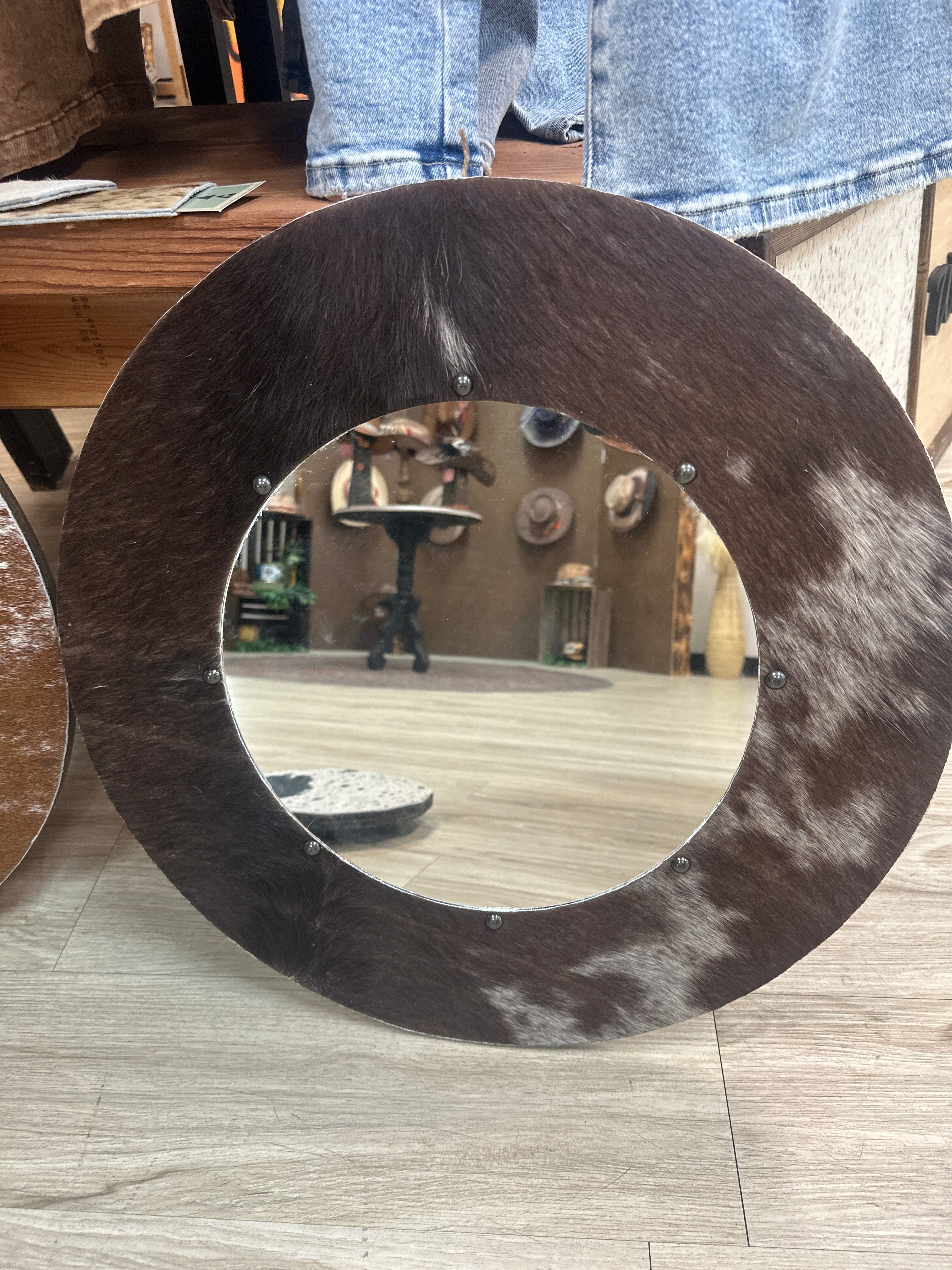 Hide round mirror with tacks